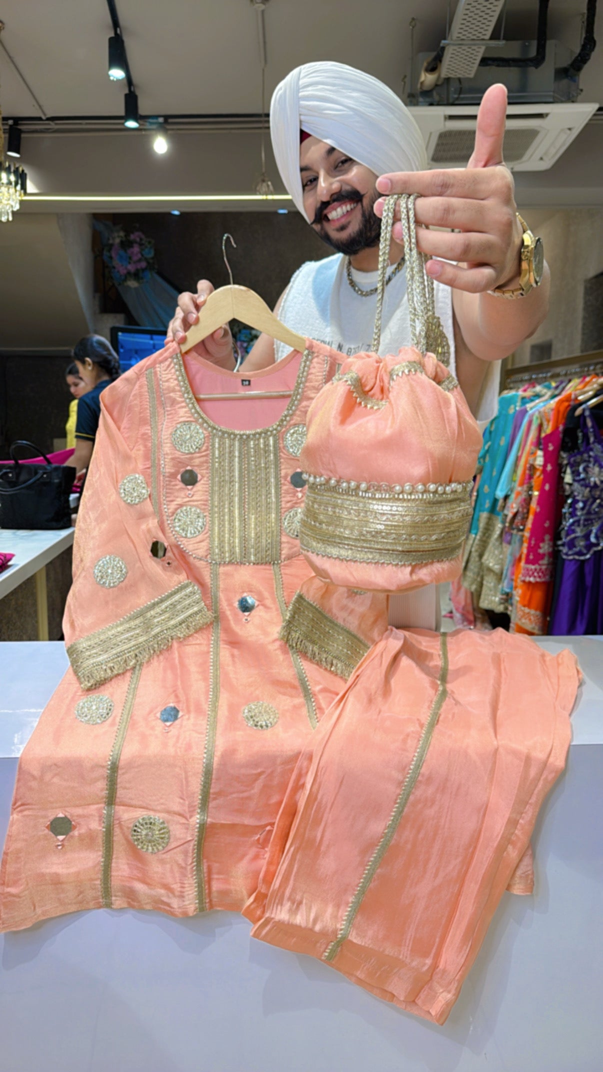 Peachish pink Heavy Gotta Work Shimmer Tissue Paplum Coord set with Cute Potli