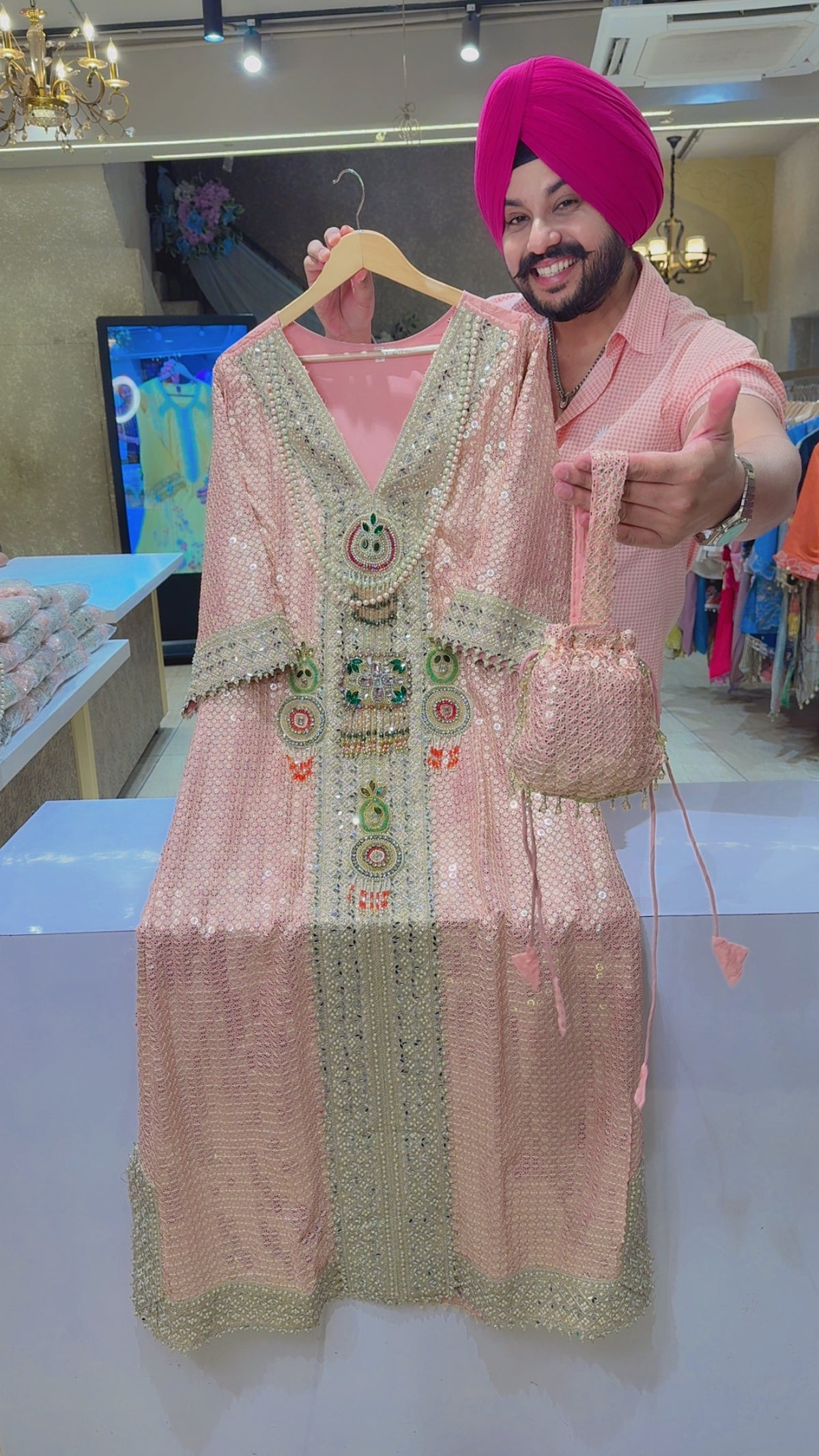 Peachish Pink Crepe Heavy Kundan Stone & Pearl Work Heavy Phiran Dress with Potli