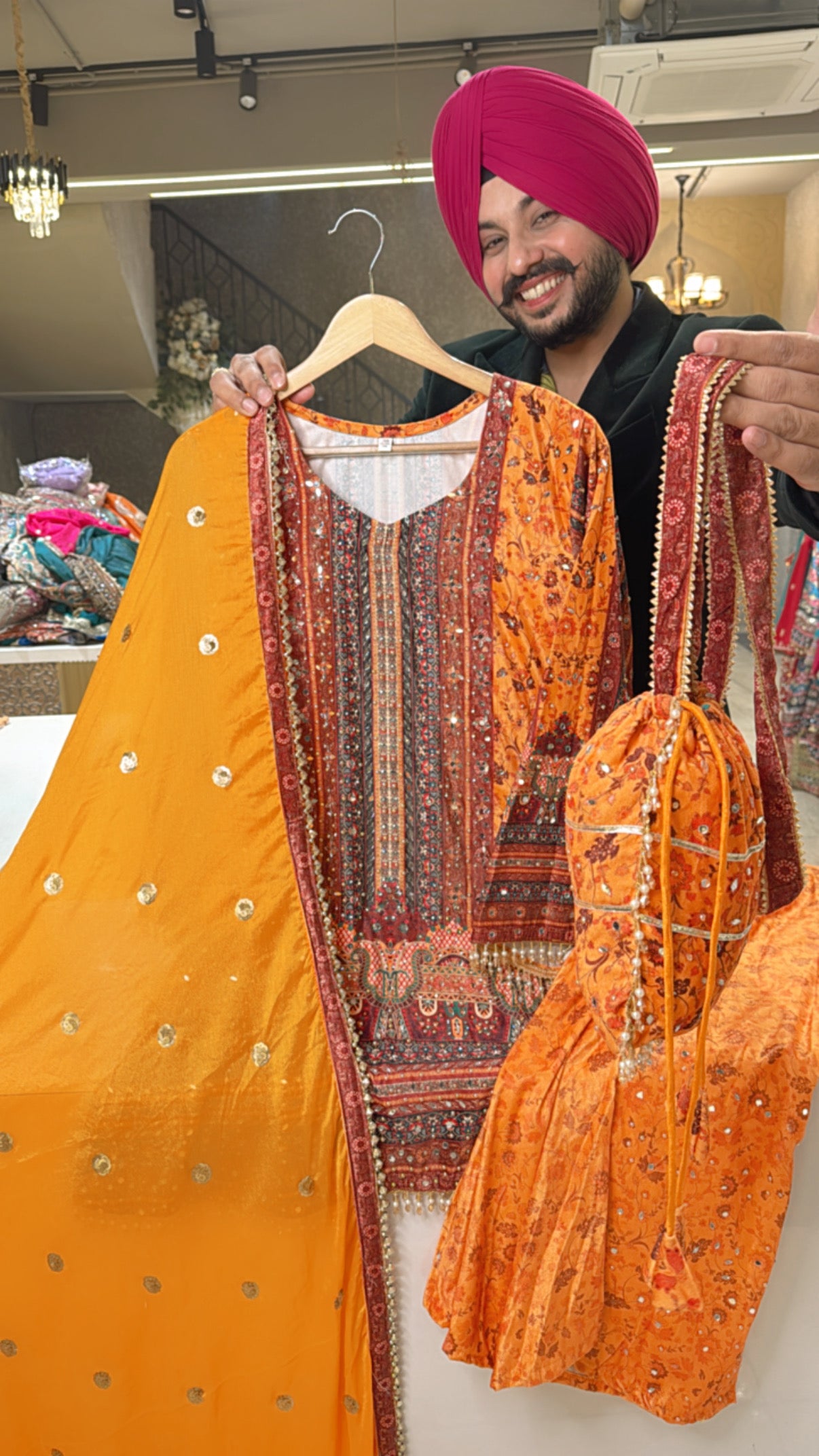 Yellowish Orange Velvet Heavy mirror work Indo western bell bottom Suit with Potli