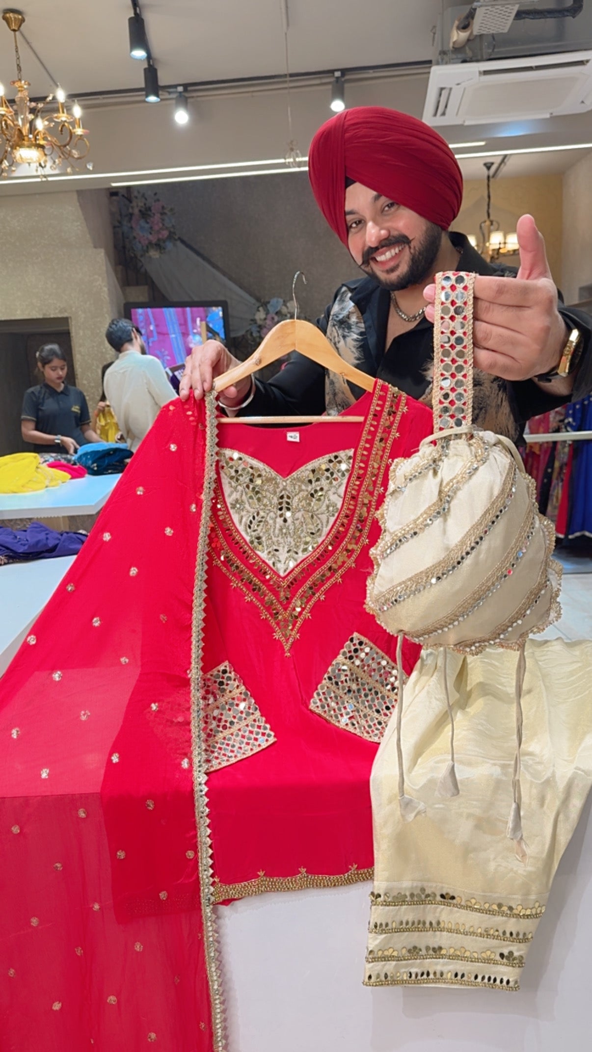 Vibrant Gajri Crepe & Shimmer Silk Heavy Hand embroidered Farshi Salwar Set with Cute Potli