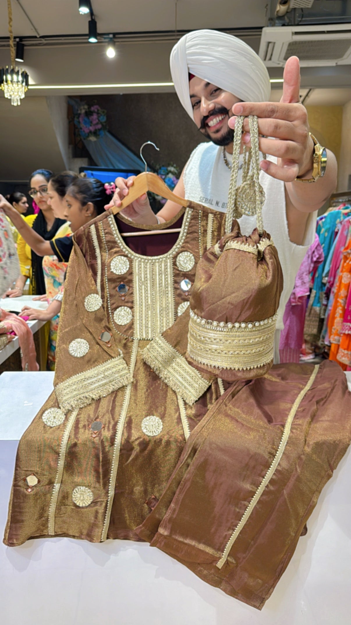 Goldenish Brown Heavy Gotta Work Shimmer Tissue Paplum Coord set with Cute Potli