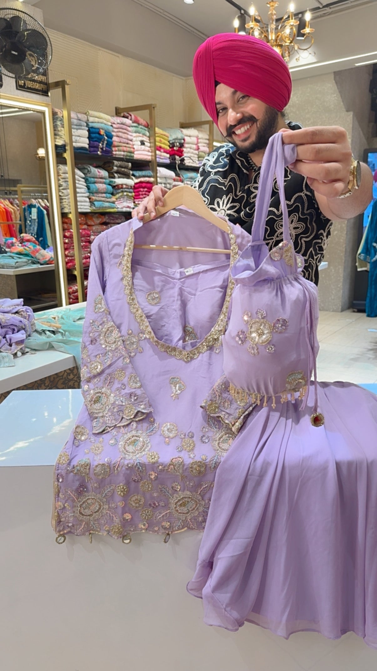 Lavender Georgette Heavy Embroidered Bell Bottom Set with Embroidered Bustier & Potli