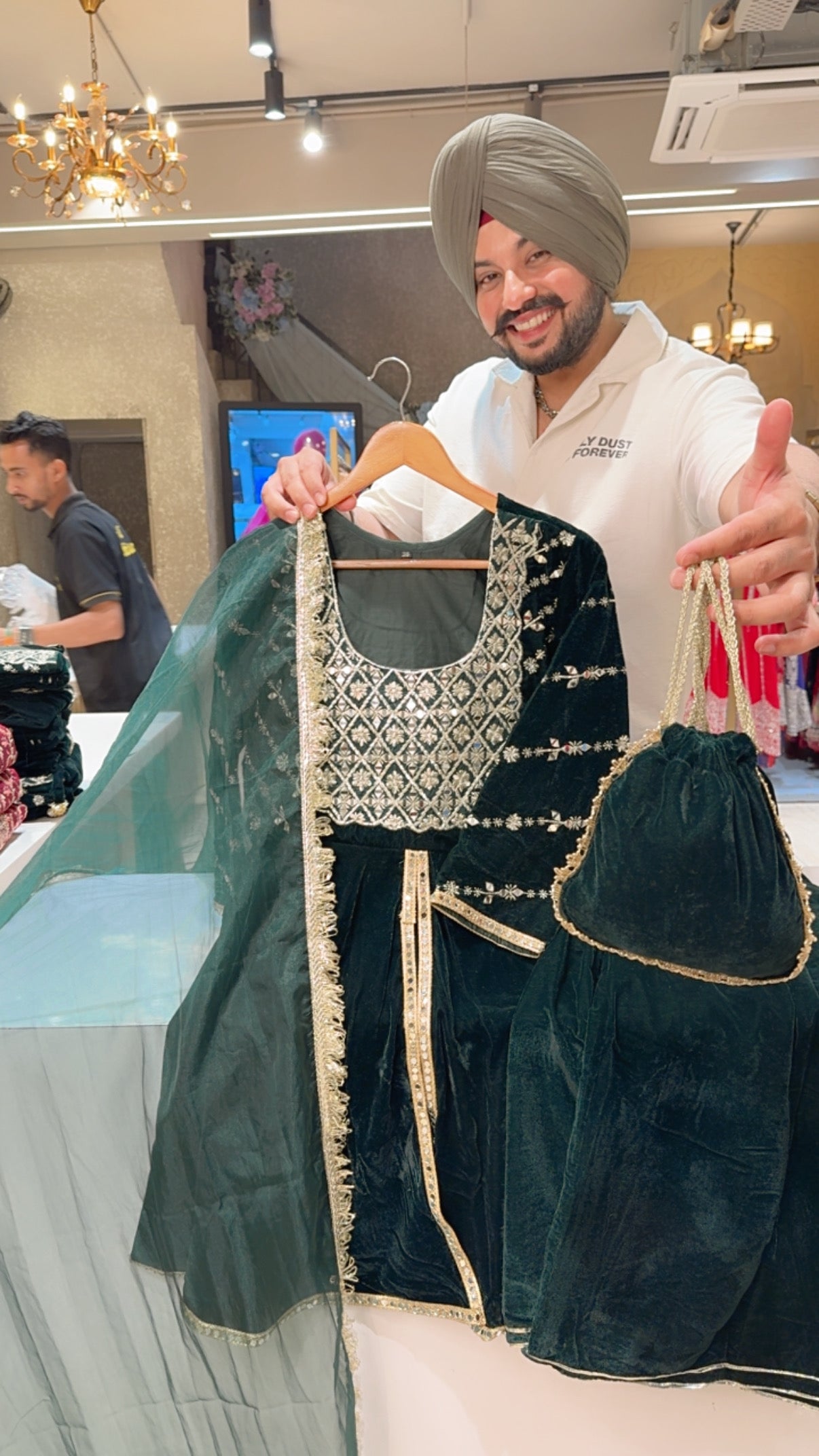 Bottle Green Velvet Heavy embroidered Front Slit Paplum Suit with Cute Potli & Organza Duppata