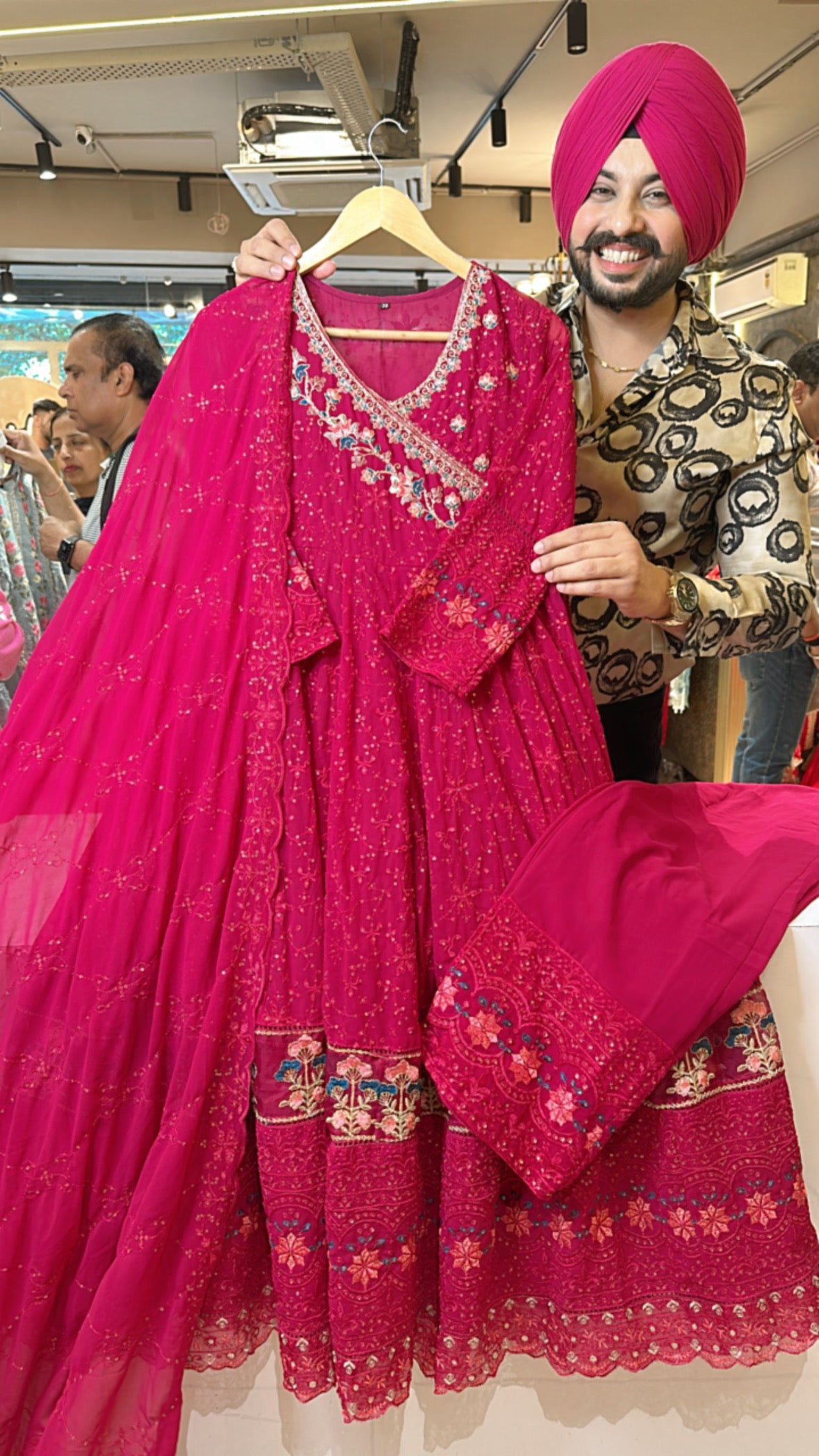 Rani pink Georgette Fully embroidered Angrakha Anarkali suit with Heavy border, pants & Duppata