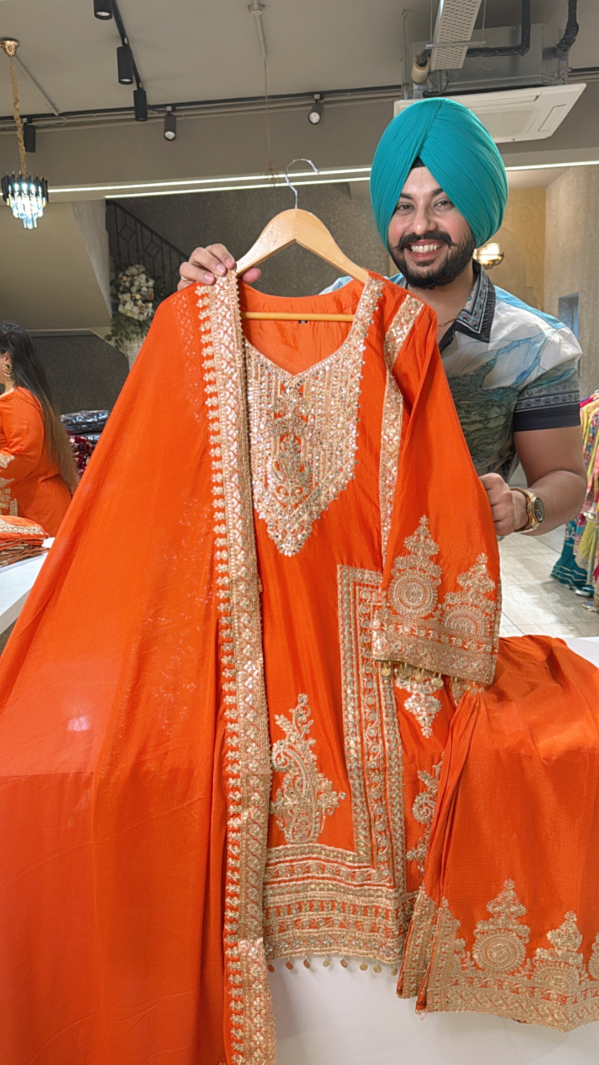 Orange Chinon Heavy embroidered Pakistani suit with Bell Bottom slide slit Pants