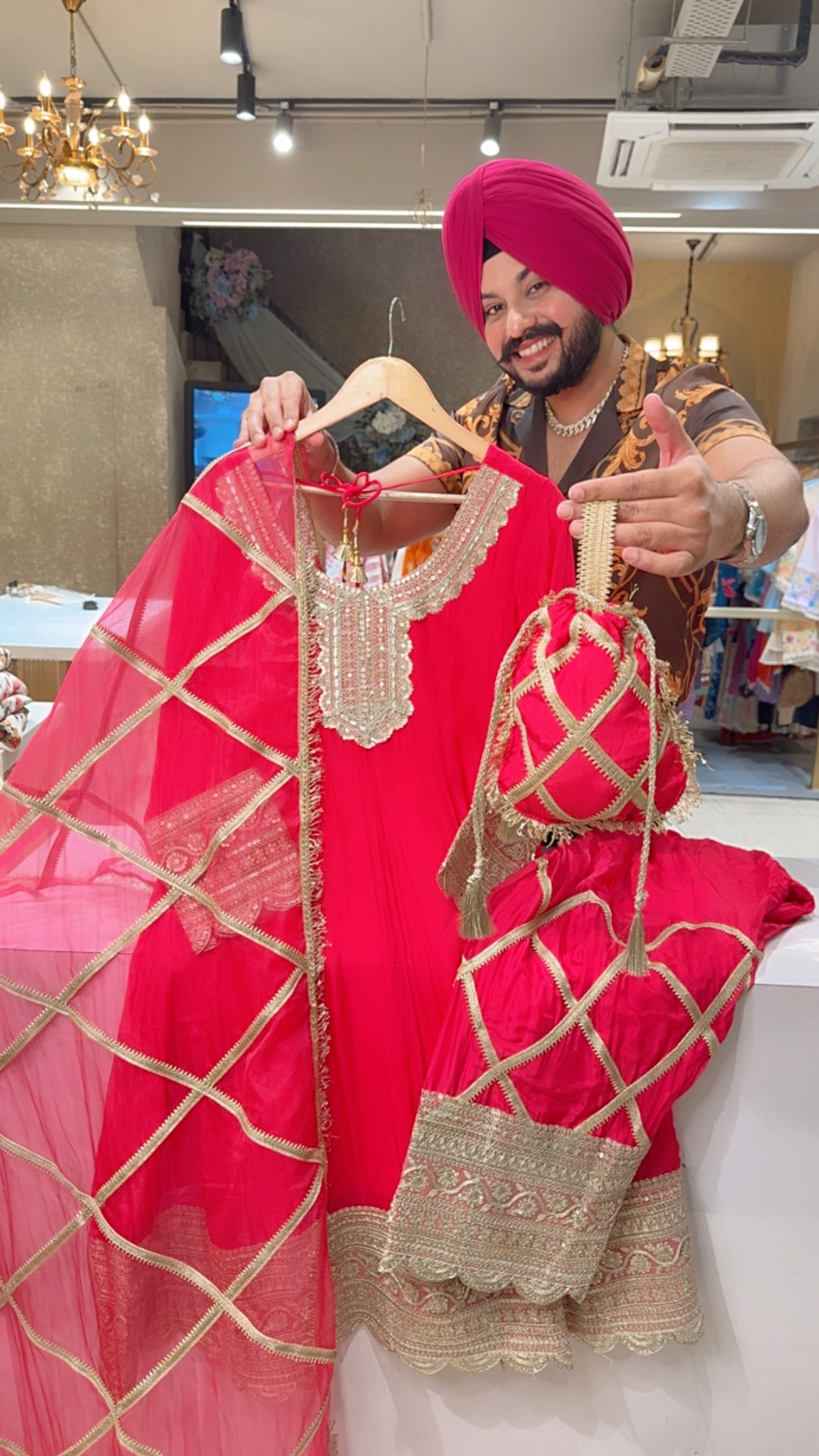 Vibrant Gajri Crepe Heavy embroidered & Gotta Work Farshi Anarkali Suit with Beautiful Duppata & Potli