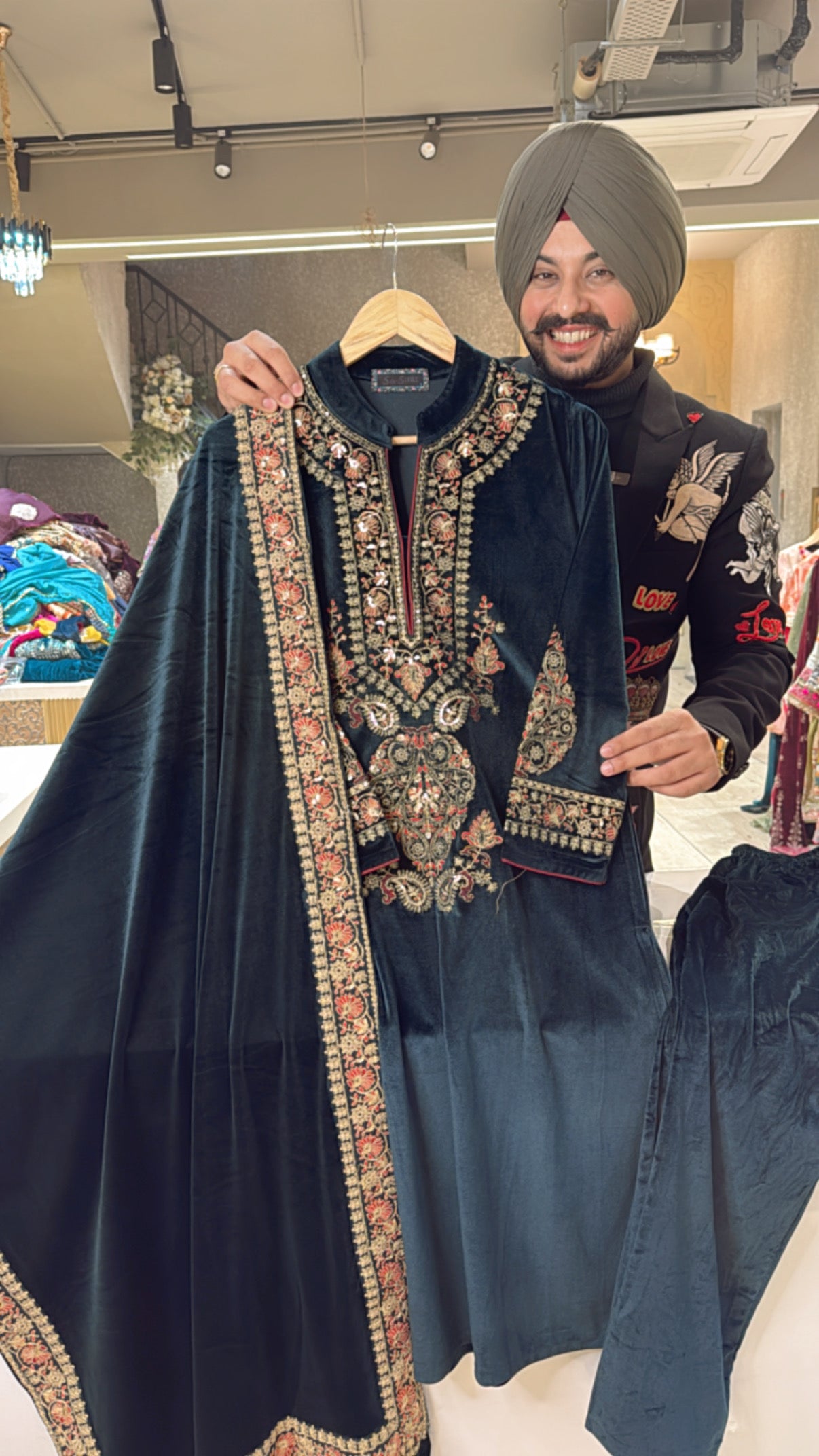 Peacock Strechable Velvet suit with heavy embroidery work on neck , sleeves & beautiful Duppata