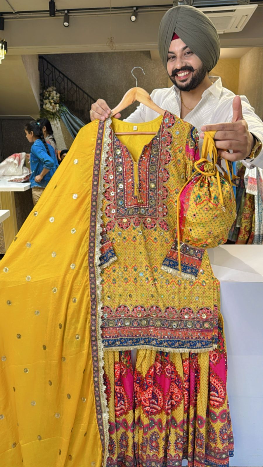 Yellow Crepe Heavy Embroidery & Mirror pasting Full Flair Garara set with Beautiful Potli & Dupatta