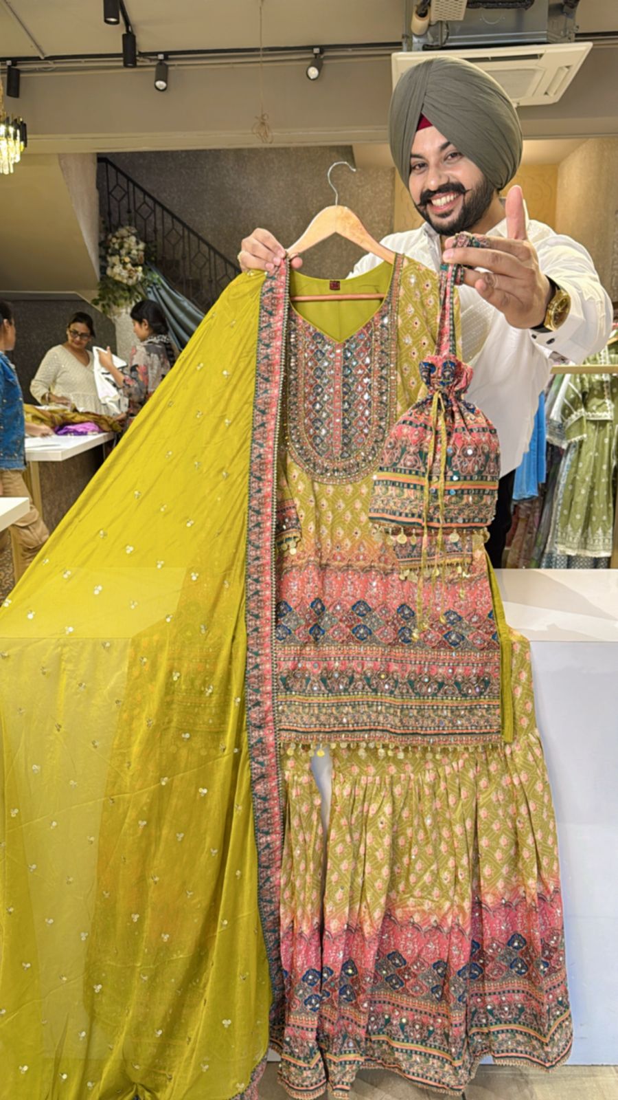 Light Mehendi Crepe Heavy Embroidery & Mirror pasting Full Flair Garara set with Beautiful Potli & Dupatta