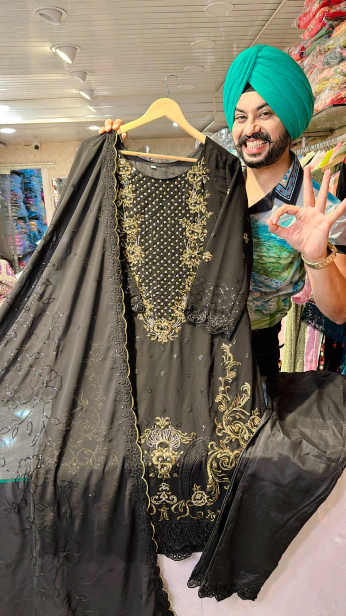 Black Georgette Pakistani Suit with heavy Embroidery work on neck