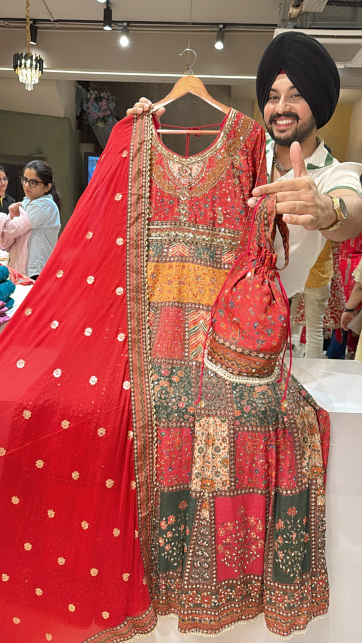 Gajri Red Crepe Heavy Hand embroidered & Mirror Pasting Anarkali Gown with cute Potli