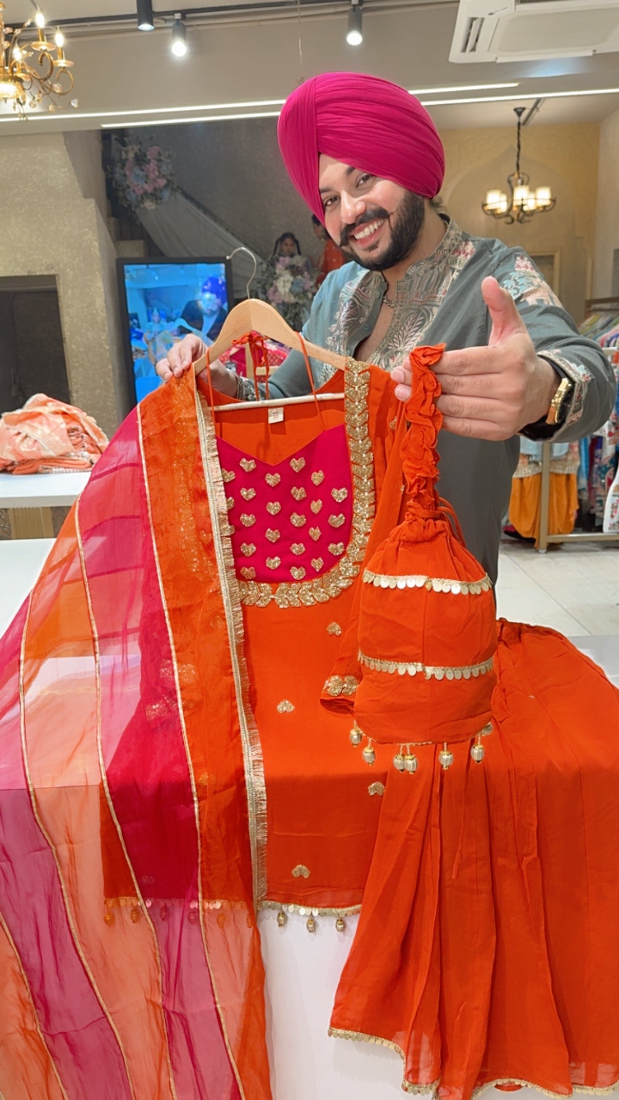 Rusty orange Georgette Heavy Hand embroidered Party wear Sharara Suit with organza Duppata & Cute Potli