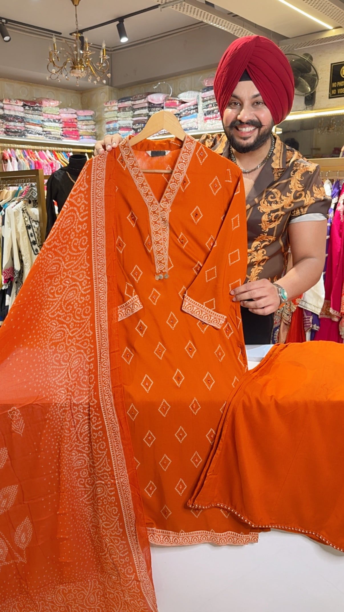 Rust Soft Rayon Bandhej Print Mirror Work Full Flair Plazo Suit