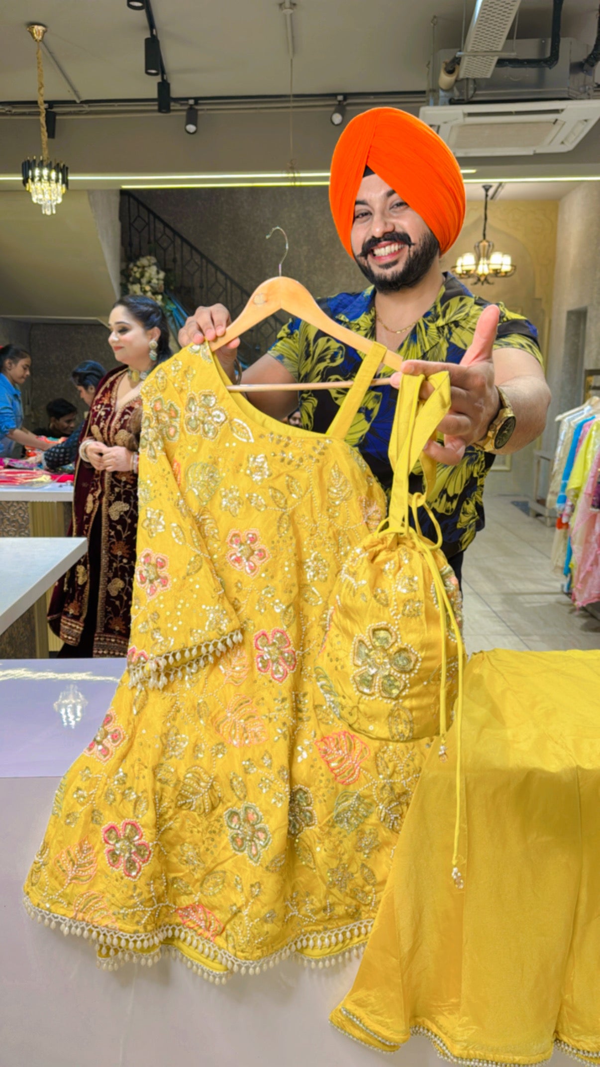 Yellow Shimmer Tissue hand Embroidered Off shoulder Paplum Azaaro Coord set with Embroidered Potli