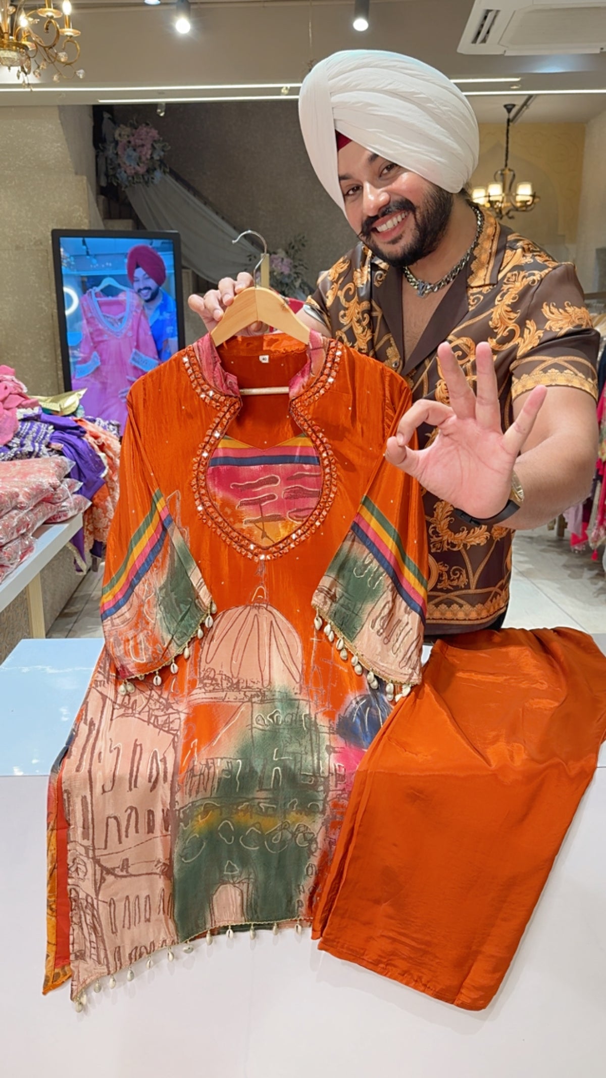 Orange crepe Designer Neck Mirror & Shell Hangings C-cut Partywear Coord set
