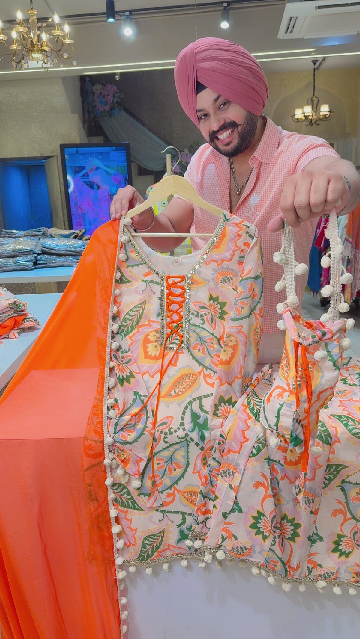 Light Beige & Orange Chiffon Full Flair Pom-Pom Sharara Suit with Pom-Pom Dupppata & Cute Potli