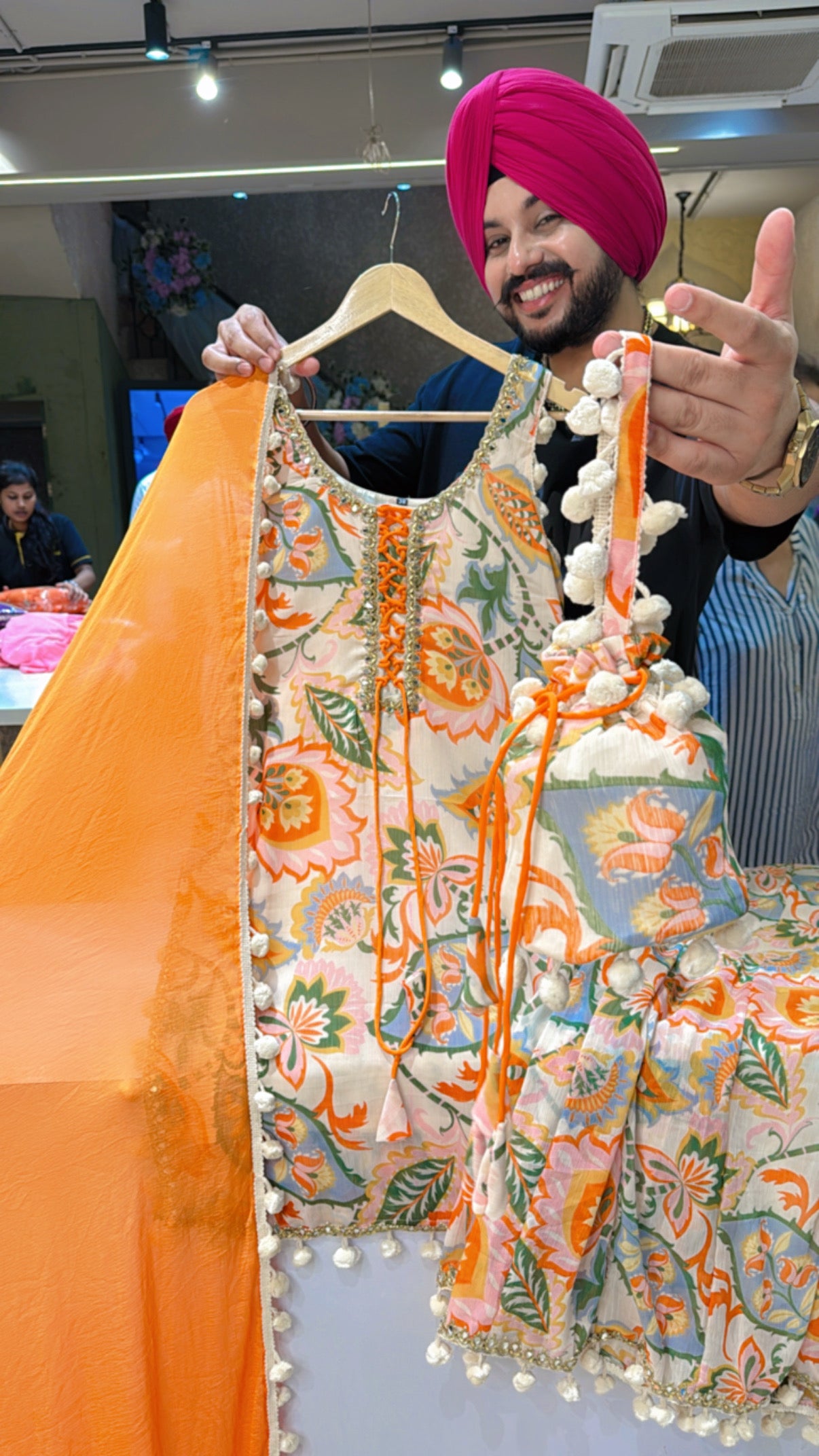 Light Beige & Orange Chiffon Full Flair Pom-Pom Sharara Suit with Pom-Pom Dupppata & Cute Potli