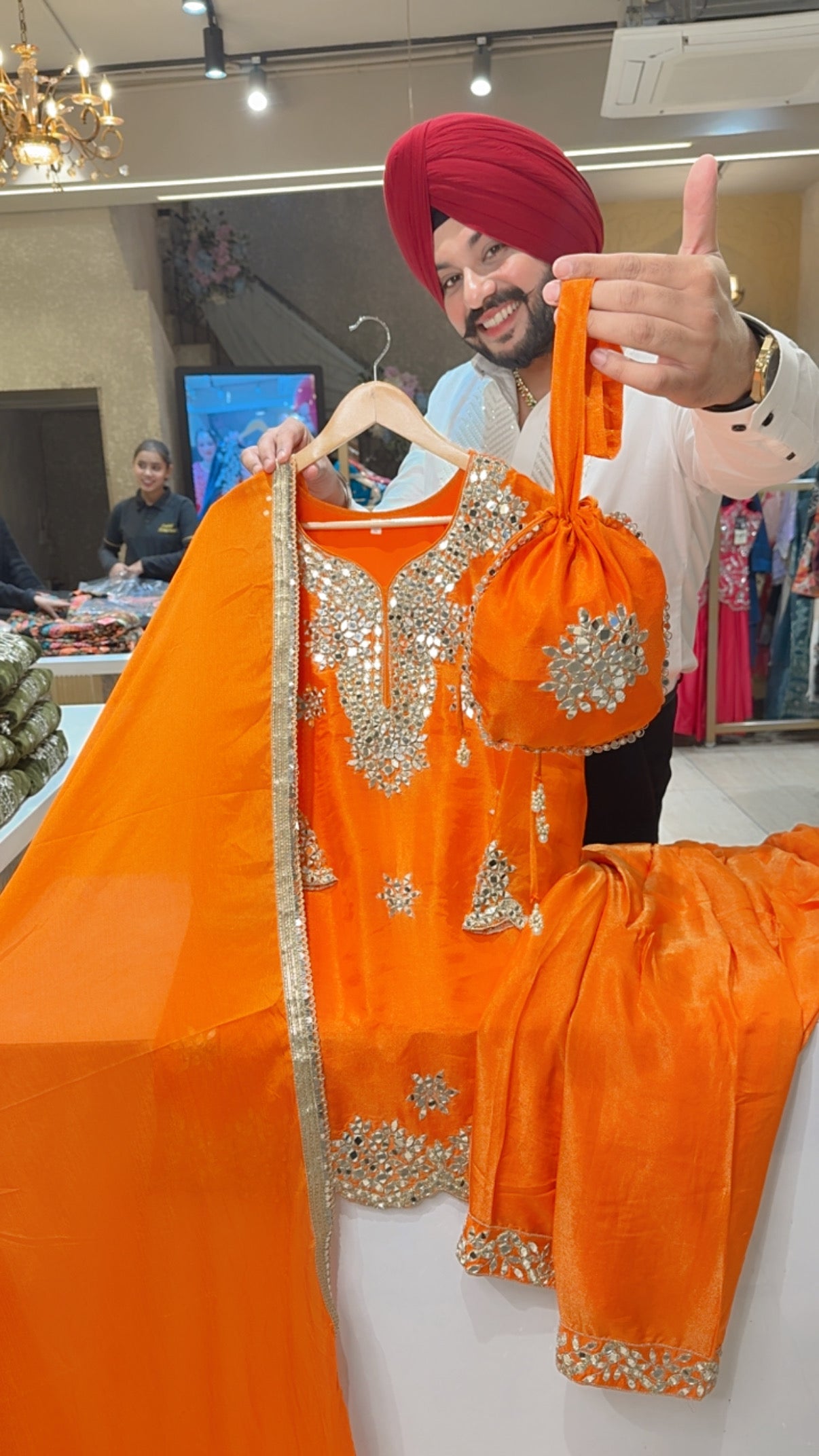 Orange Shimmer Silk Heavy mirror work PartyWear Salwar Suit with Cute Potli