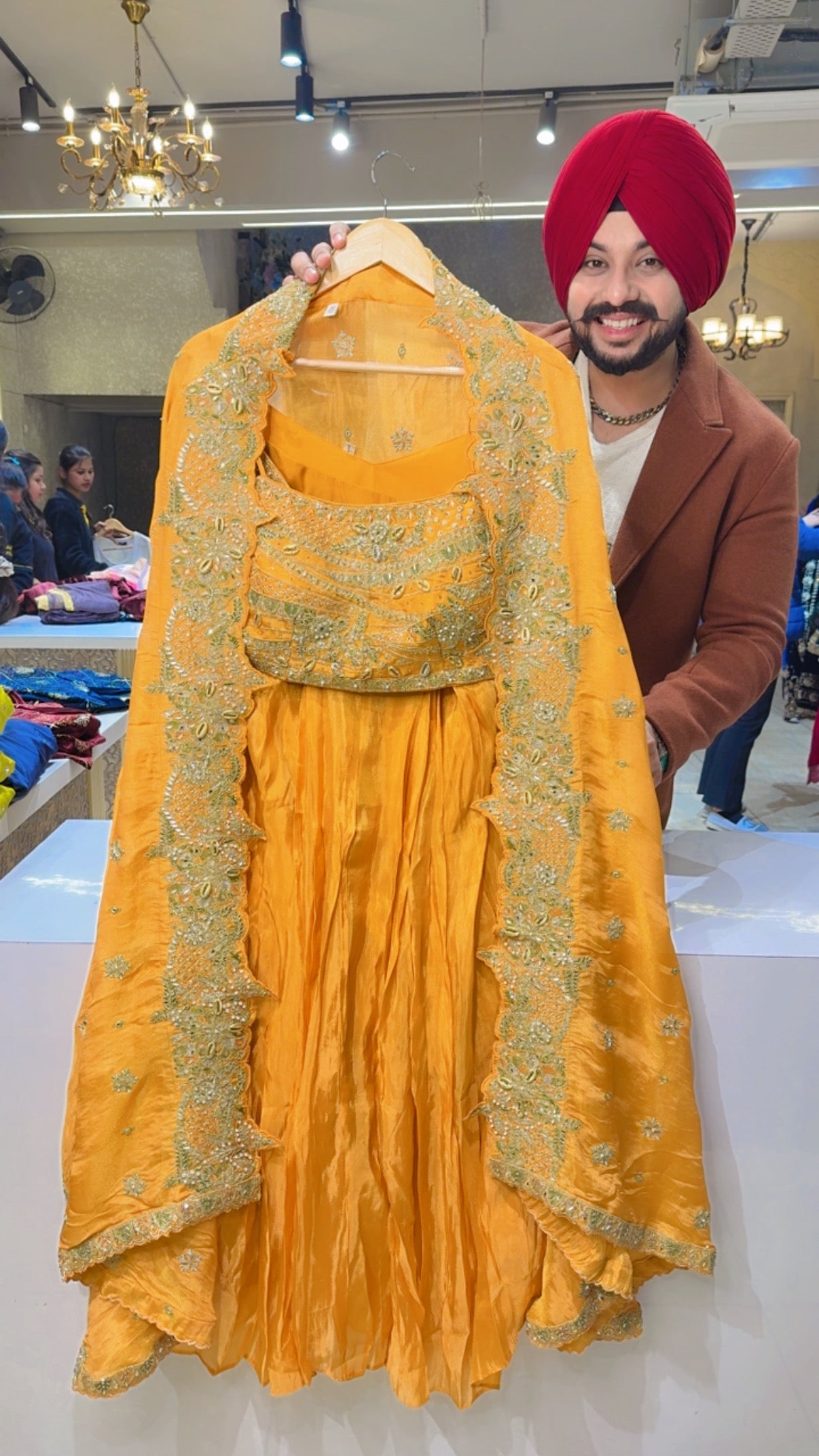 Yellowish Orange Hand embroidered Drape Crop Set with Heavy embroidered Shrug & Potli