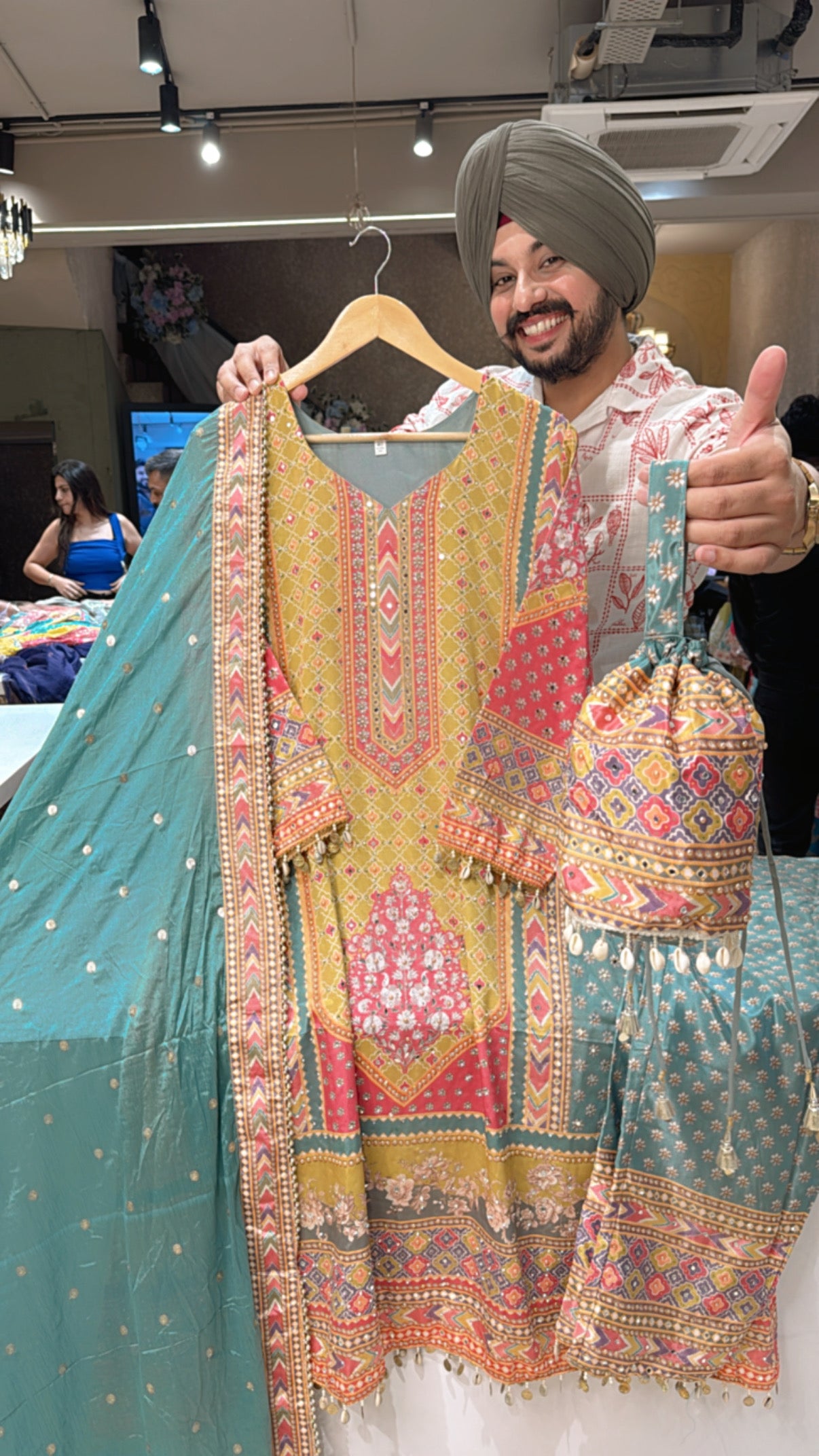 light Rama green & MultiColored Crepe Heavy Mirror Pasting & Shell Hangings A-line Suit with Cute Potli