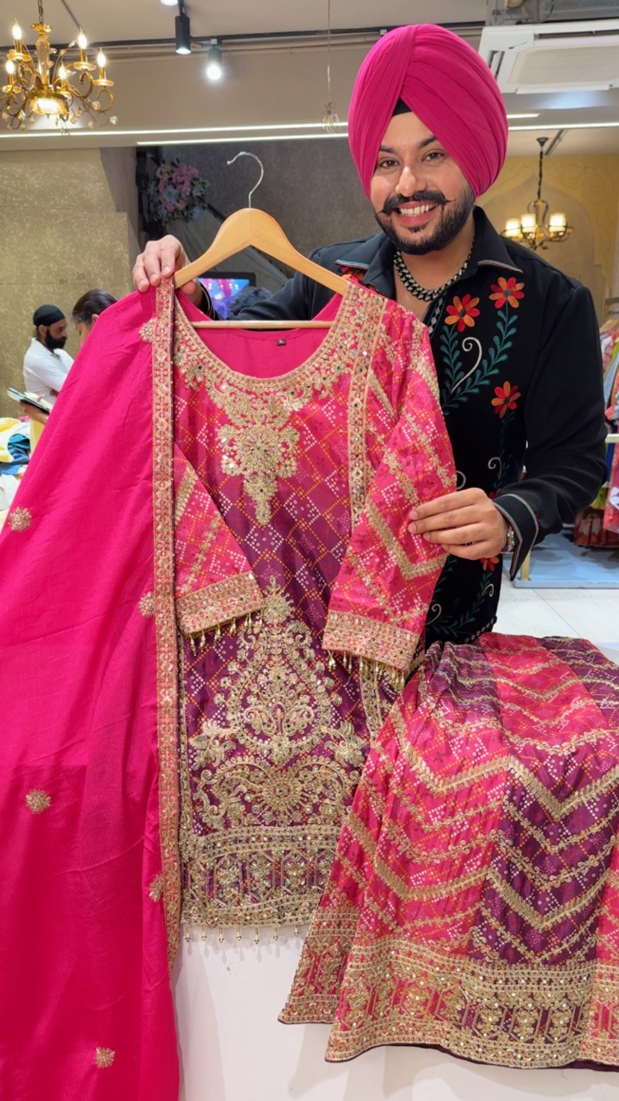 Hot pink Bandhej print Full Flair Fully embroidered Sharara suit