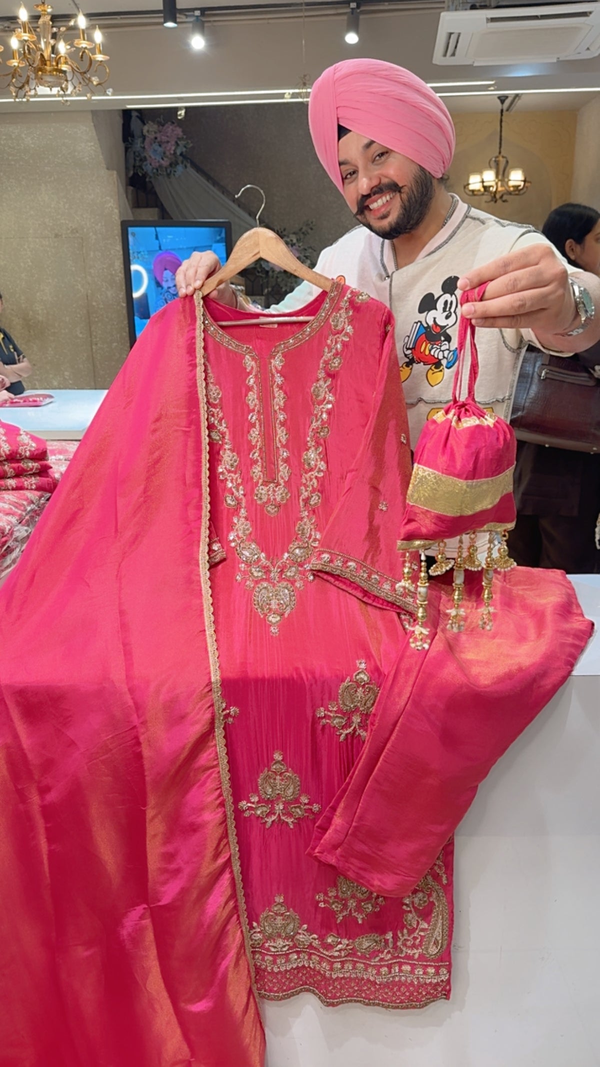 Pink Shimmer Silk Fully Hand embroidered Suit with designer Potli