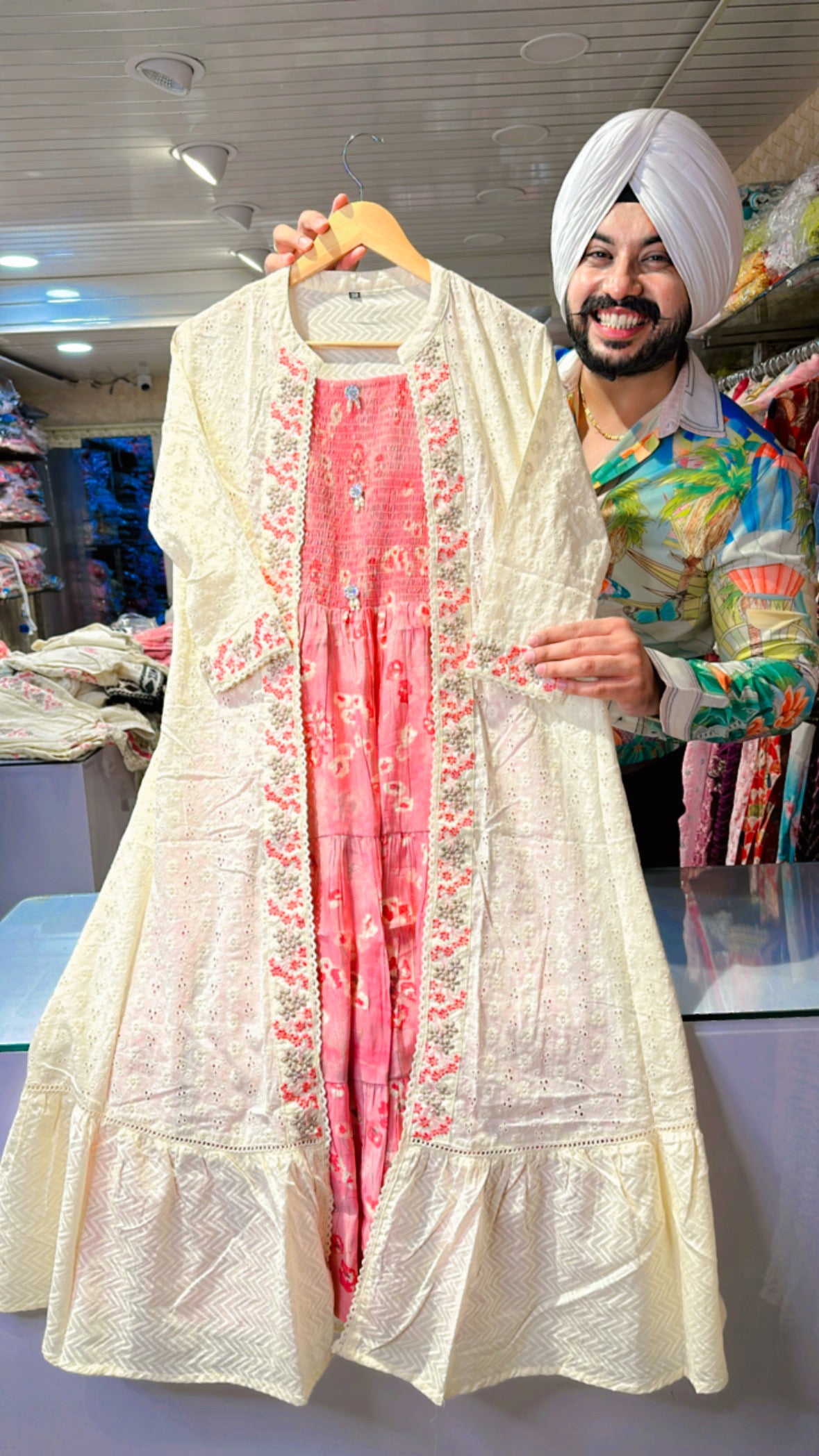 Pink muslin silk Indowestern dress with off white
embroidered shrug