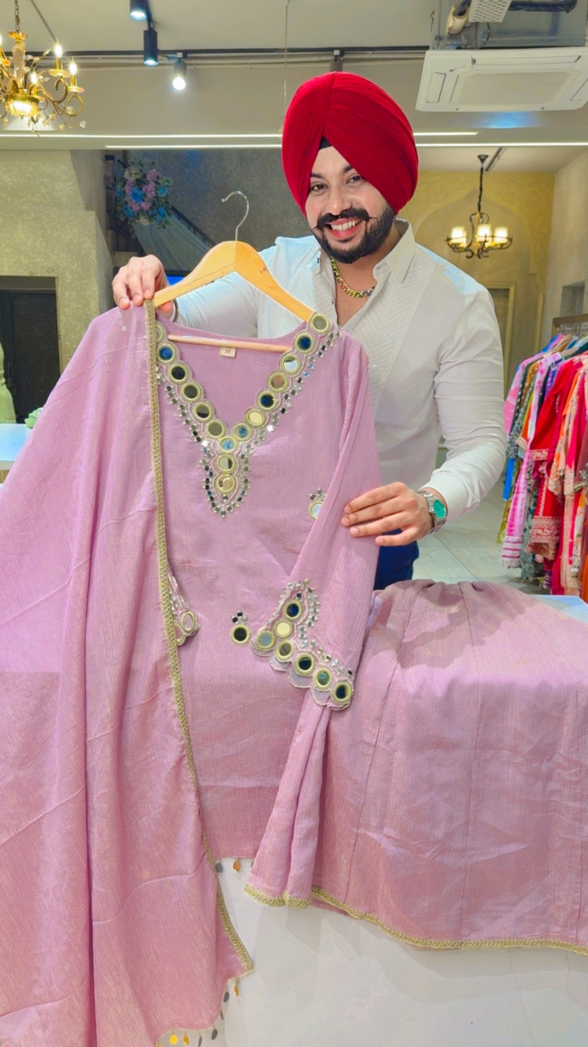 Mauve Shimmer Silk Tissue Full Flair Sharara suit with Heavy mirror Work on it